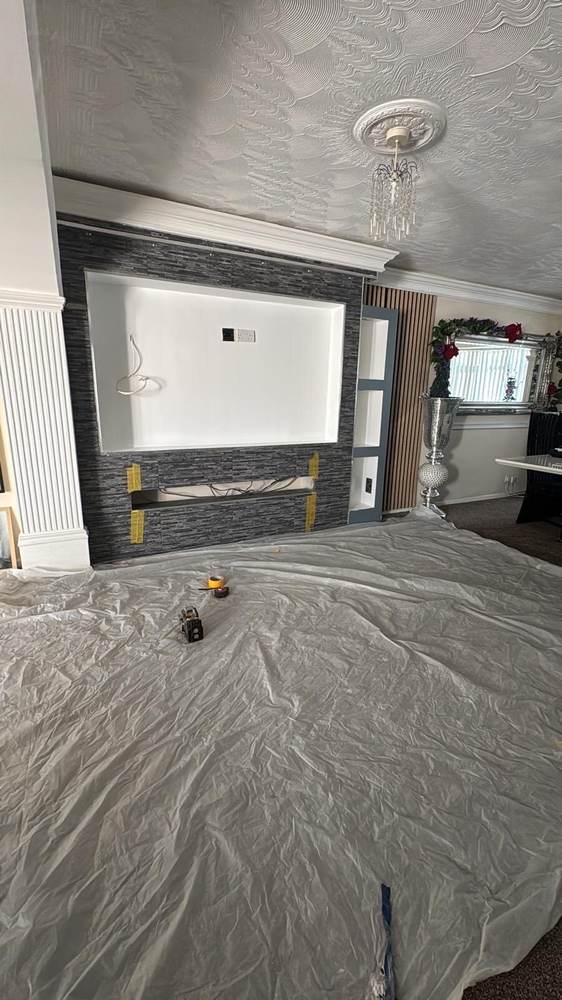 Feature TV wall with tiled surround and cornicing