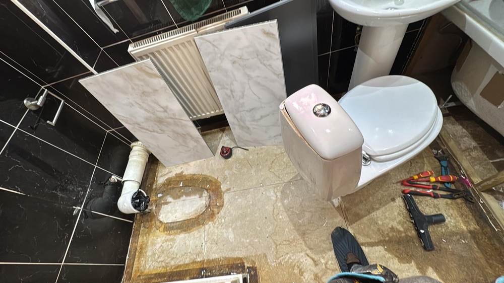 Strip-out — old tiling and fittings removed