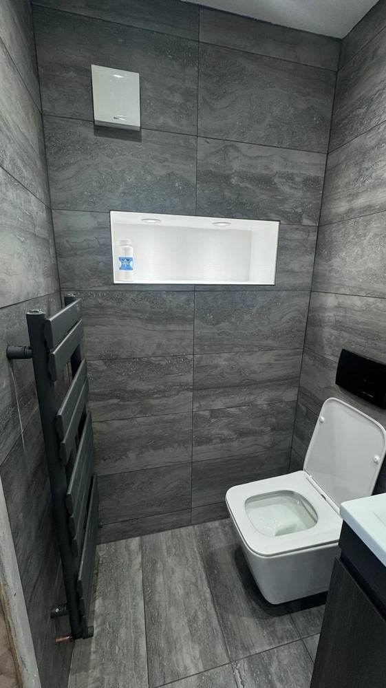 Heated towel rail and recessed lighting