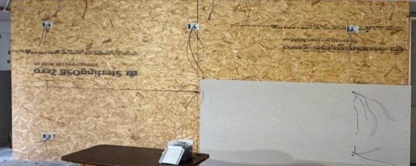 Stud wall build with electrical first fix