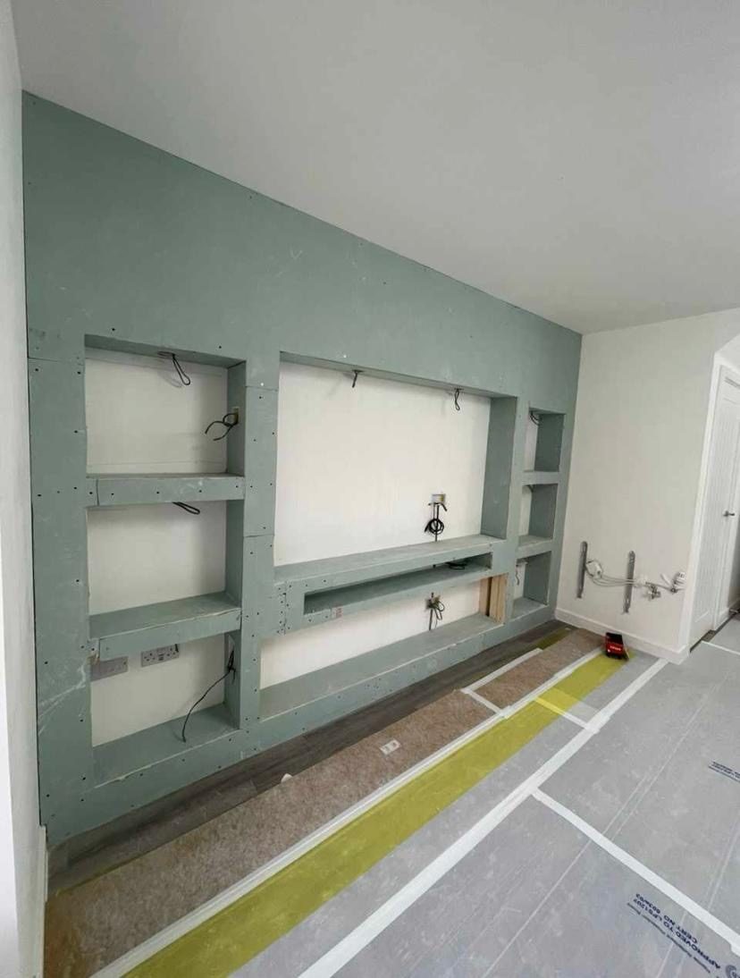 Boarded media wall carcass, first fix wiring visible