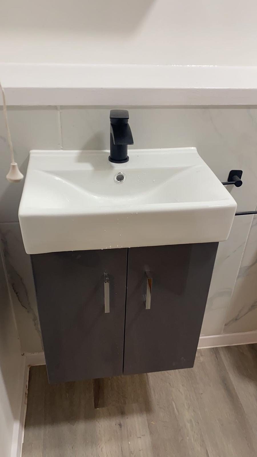 Wall-mounted vanity unit and basin, finished bathroom