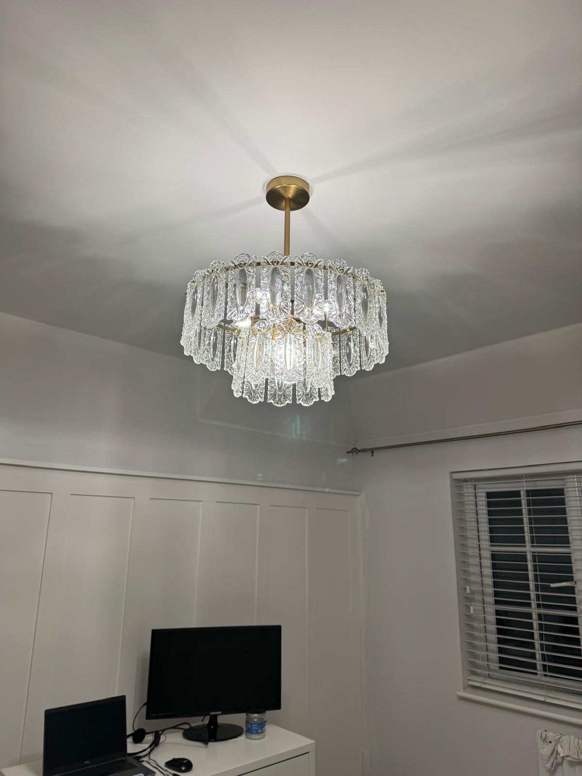 Statement crystal chandelier fitted above home office